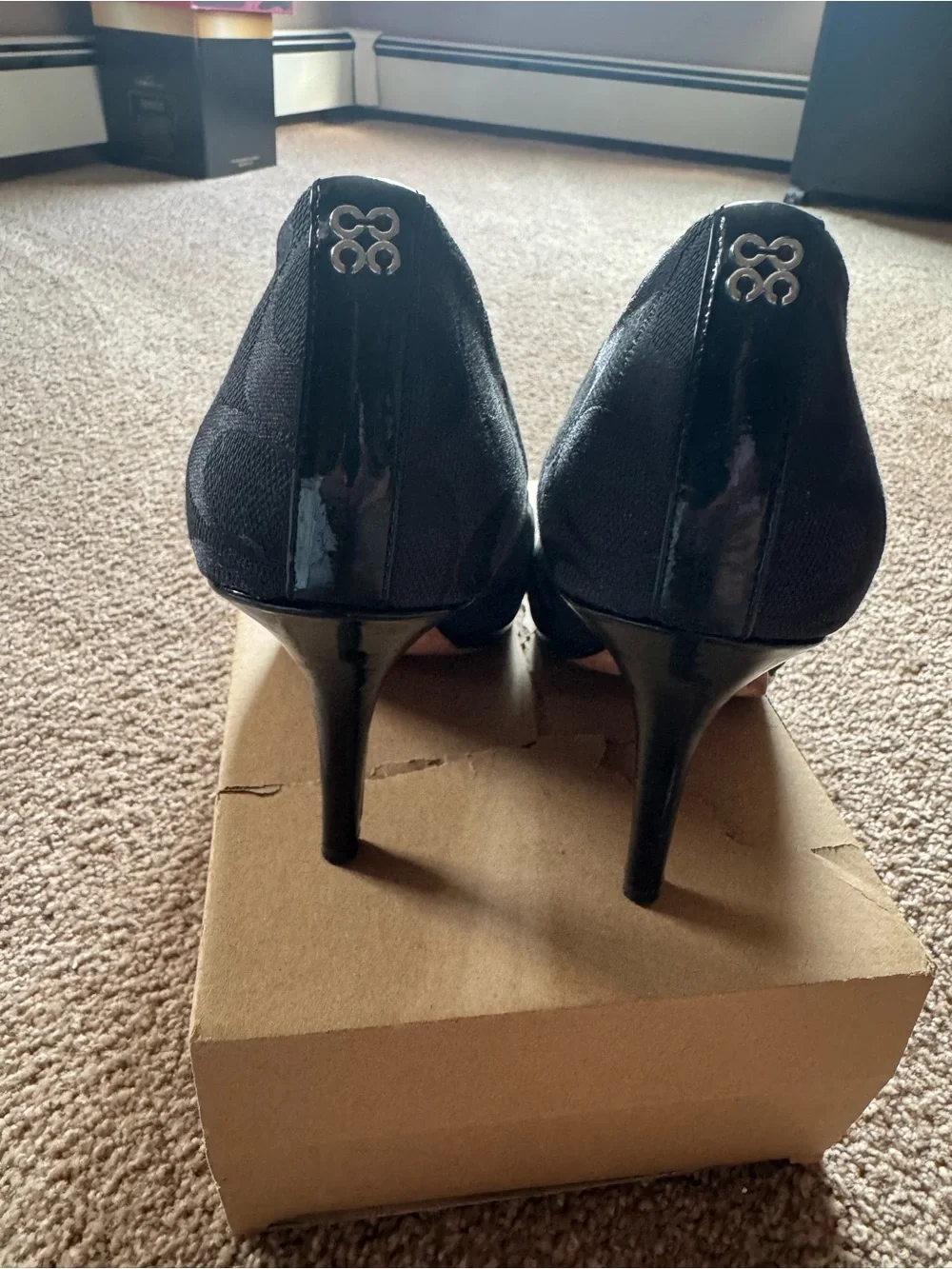 Coach Black Signature Canvas Pointed Toe Pumps, with Pattern leather detailing.